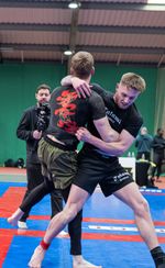 Two happy athletes resting between BJJ classes